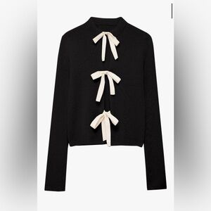 Elegant Black Sweater with Cream Bows